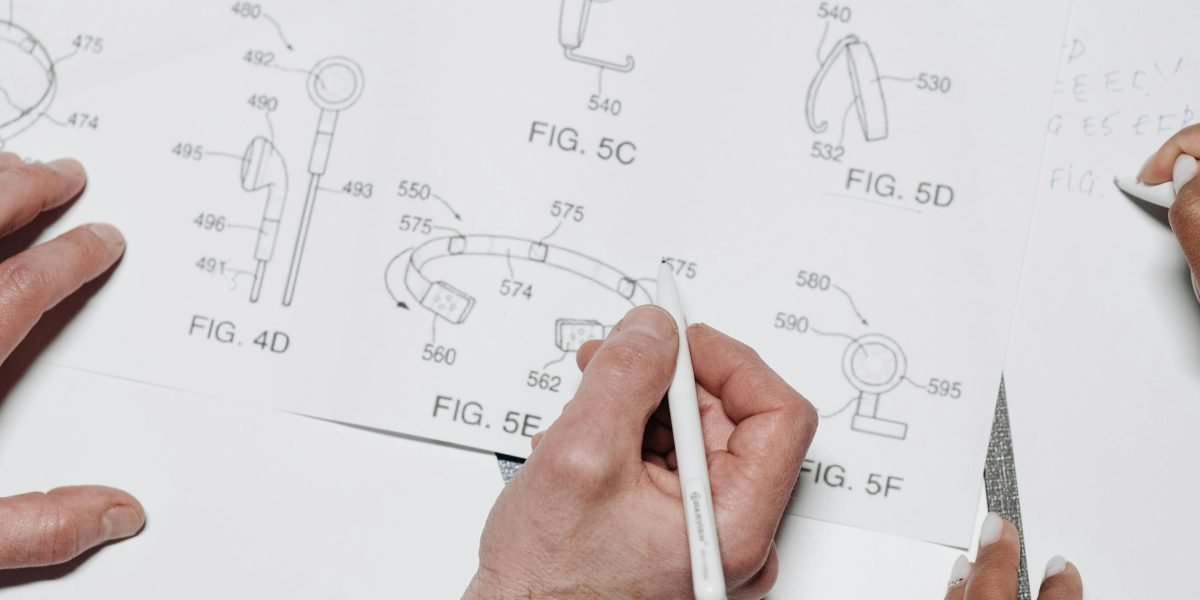 A UX designer actively sketching wireframes to conceptualize user-friendly product interfaces.