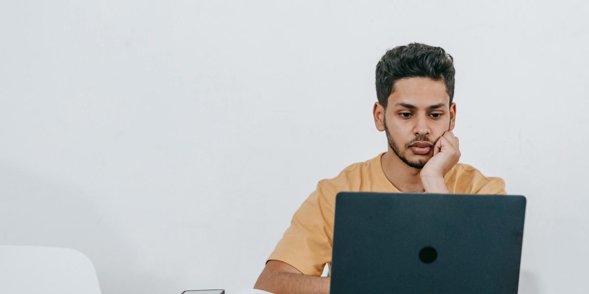 An individual engaged in online learning, highlighting the accessibility of web development courses.
