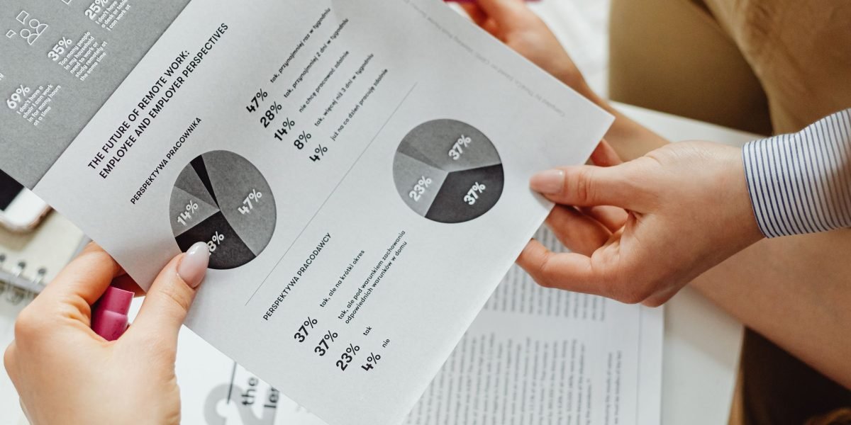 Business leaders analyzing performance reports and metrics in an office setting.
