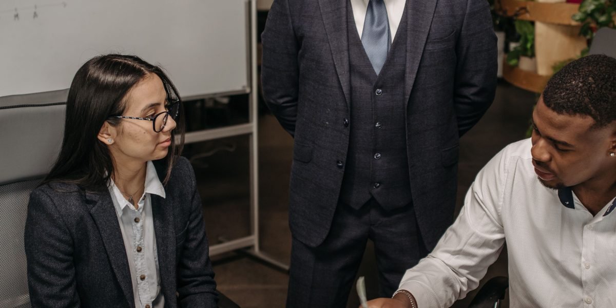 A diverse team in a high-stakes environment, intensely collaborating and communicating to resolve a critical system incident.