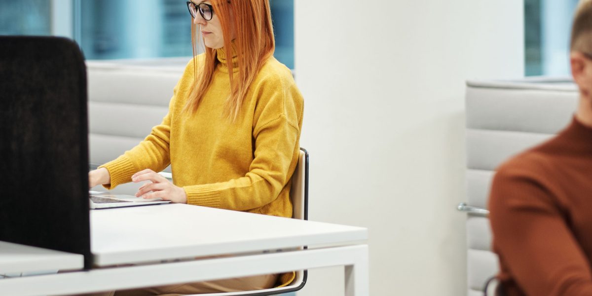 A professional works efficiently, demonstrating the productivity gains from AI-enhanced low-code/no-code platforms.