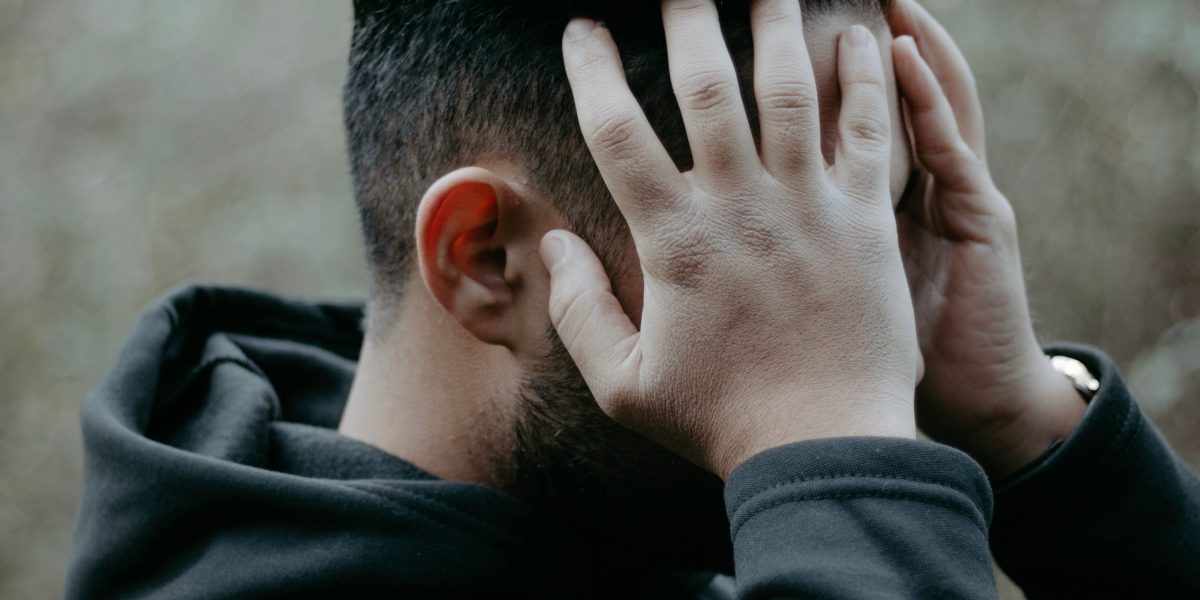 A person feeling overwhelmed while browsing numerous options online.