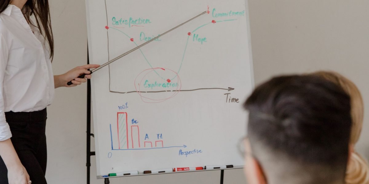 An experienced professional mentoring a team, symbolizing the development of new skills and future-proofing in AI-first engineering.