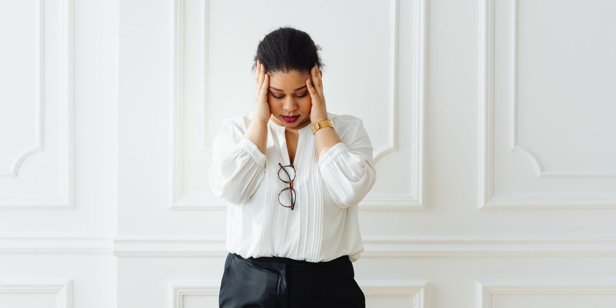 A person looks frustrated, symbolizing the challenges and 'big headaches' that arise from ad-hoc technology evaluation.