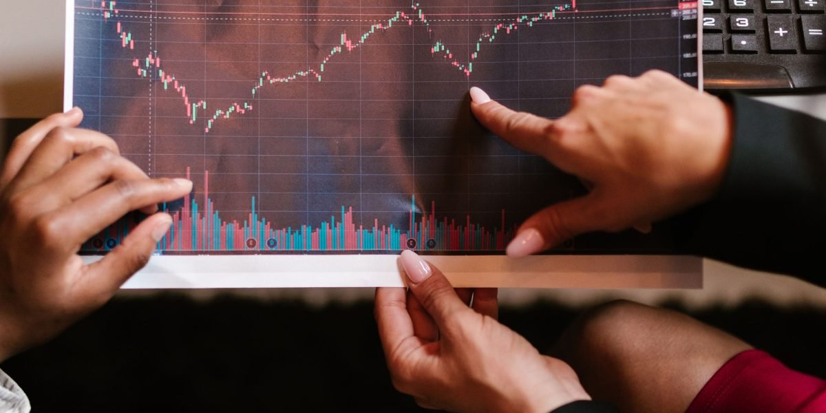 A group of professionals analyzing charts and data on a large screen, evaluating project performance and outcomes.