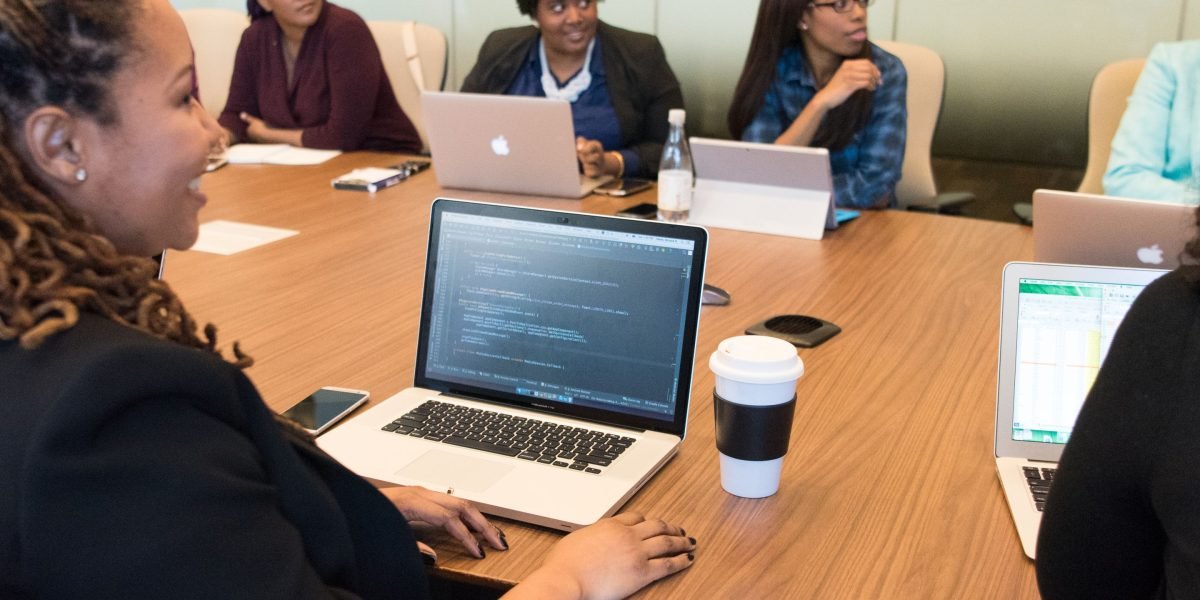 Engineers in a meeting room, actively discussing performance needs and technical trade-offs for cloud compute options.