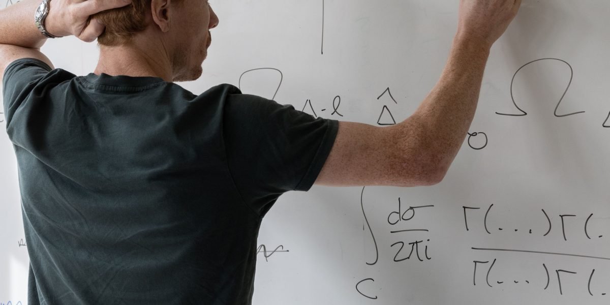 A person deeply focused, symbolizing the development of critical thinking and a strong knowledge base for career growth.