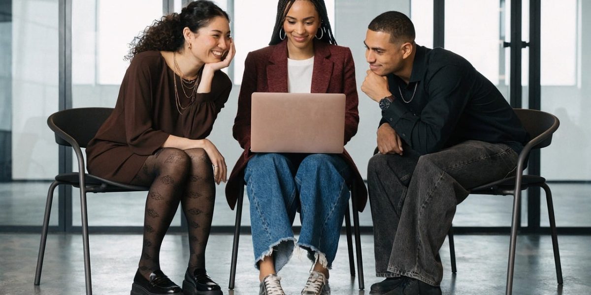 A diverse group of professionals collaborating and working together in a modern, busy office environment.