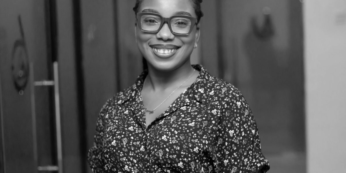 A confident professional smiling, symbolizing career growth and validated skills through certifications.