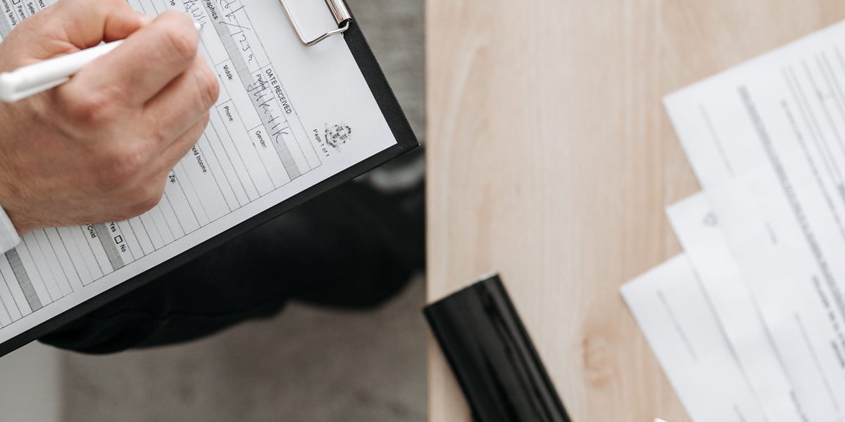 A professional focused on reviewing compliance documents, ensuring adherence to regulations and security standards.