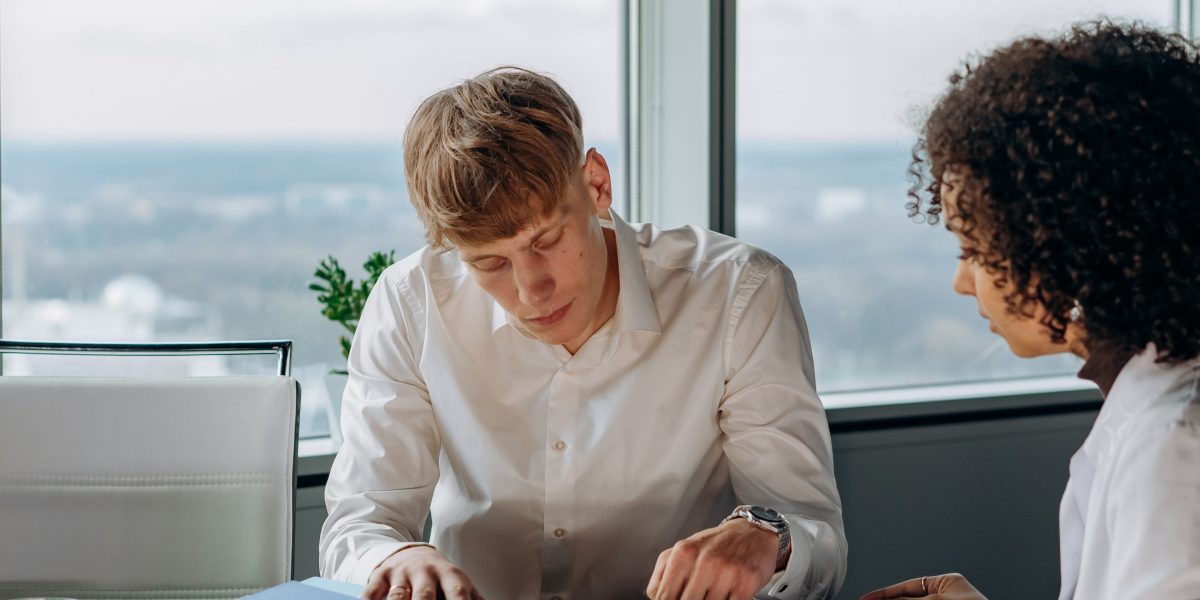 Professionals diligently reviewing compliance documents, highlighting the importance of governance in AI.