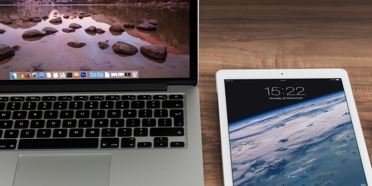 A developer comparing a website's appearance and functionality across multiple Apple devices.