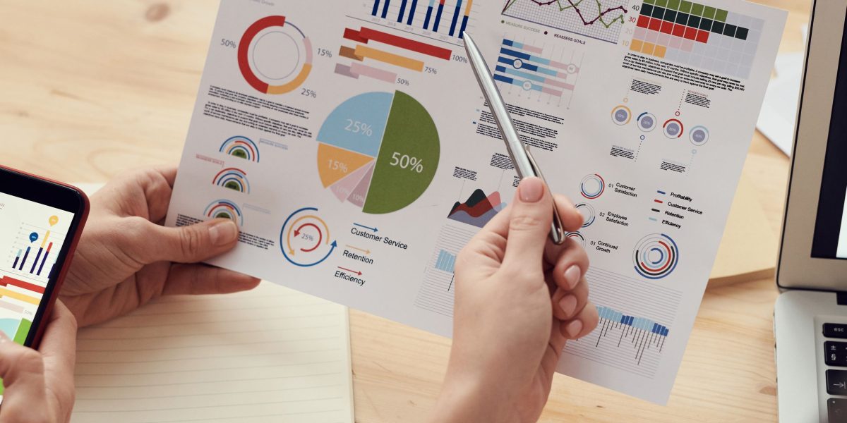Business professionals analyzing metrics to understand the impact and return on investment of new initiatives.