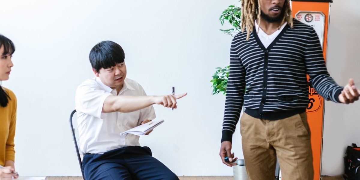 A group of diverse professionals participating in a training session or workshop.