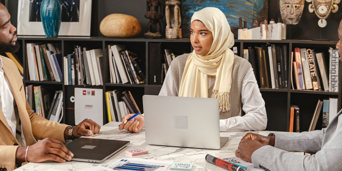 Two professionals discussing a project, highlighting the importance of skills and university quality to employers.