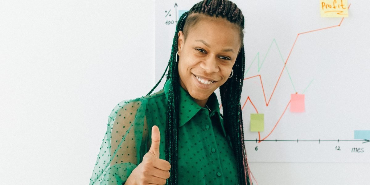 A team member confidently presents the successful outcome of a no-code project to colleagues.