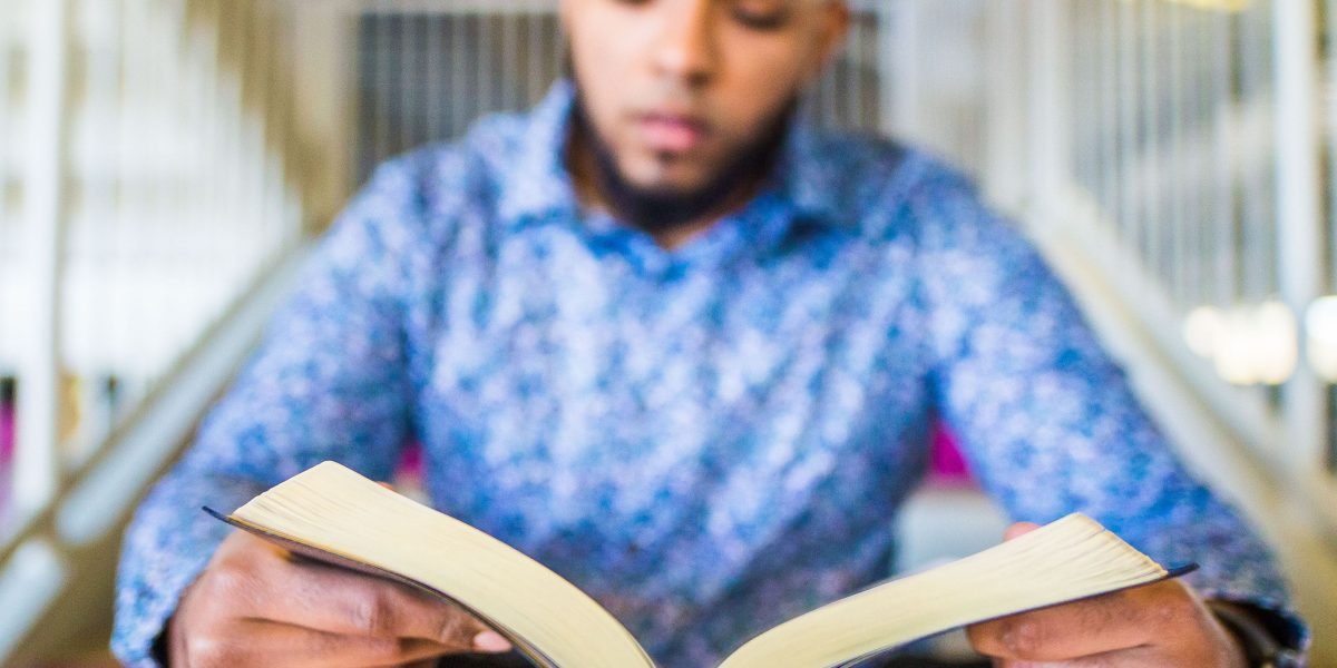 A focused individual actively engaged in learning new skills, representing dedication to upskilling and career transition.