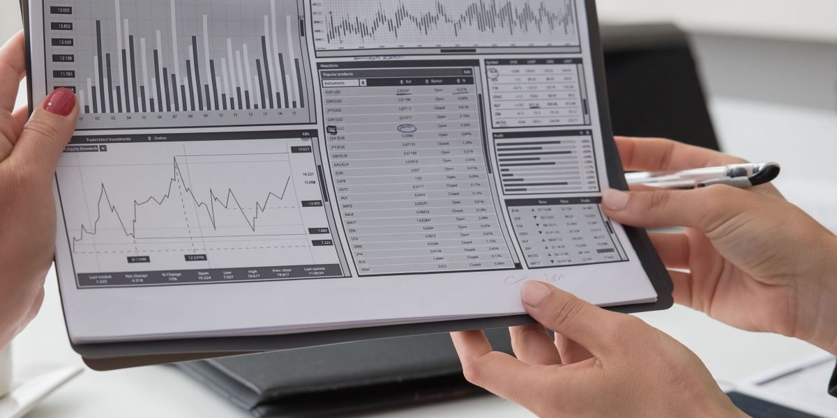 A diverse team reviews complex dashboards, collaboratively analyzing performance metrics to ensure cloud system health.