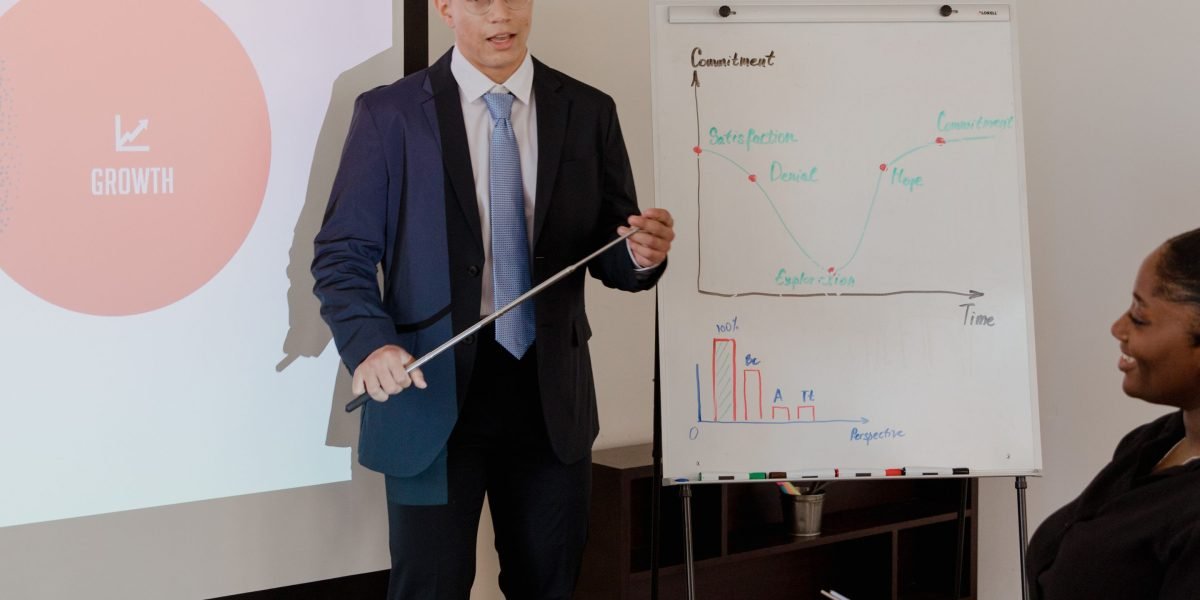 Business leaders engaged in a focused discussion, analyzing market trends and making strategic decisions.